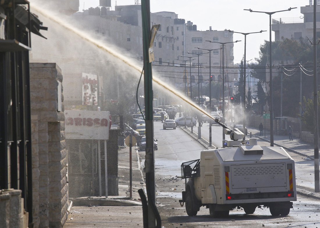 Rehab Nazzal, A “Skunk” truck spraying sewage on Palestinian homes and workplaces in Bethlehem, 2015.