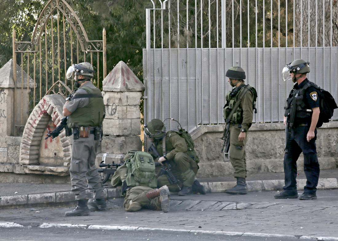 A 2015 photograph by French photographer and activist Anne Pak of Israeli sniper who shot several Palestinian protesters in the same day I was shot.